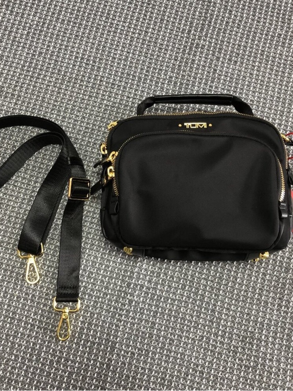 Tumi Black Nylon Crossbody Bag with Gold Hardware Accents